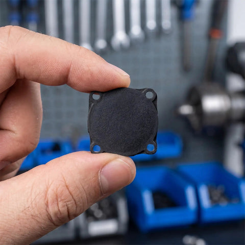 Three Pack Rubber Pressure Switch Gaskets For Air Compressors, Wear-Resistant Seal Pads, Leakproof Switch Seals, Go-To Replacement Spare Parts For Air Pumps And DIY Compressor Repairs. Black rubber gasket held between fingers, close-up.