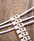 Close-up of 12-Position Dual Row White Screw Terminal Block Set 10 A 380 V Wire Connector Electrical Barrier Block