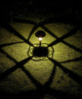 Six Pack Solar Pathway Lights Outdoor Waterproof Garden Lights casting shadows on grass at night, warm white LED.
