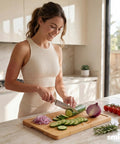 Heavy Duty 3 Piece Bamboo Cutting Board Set With Wooden Stand For Everyday Kitchen Tasks, woman chopping cucumbers.