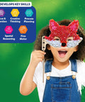 Child wearing a red and white fox mask from Poke In Art Animal Masks Craft Kit With 800 Plus Fabric Squares And 6 Foam Masks Mess Free Sewing Activity For Kids Ages 4 5 6 7 8 9 A Fun Creative Gift For Girls And Boys Who Love Hands On Arts And Imaginative Play And Kid Friendly Fun.