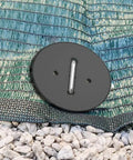 Close-up of 100 Pack 6 Inch Landscape Staples With Gasket Washers for landscaping fabric secured on gravel