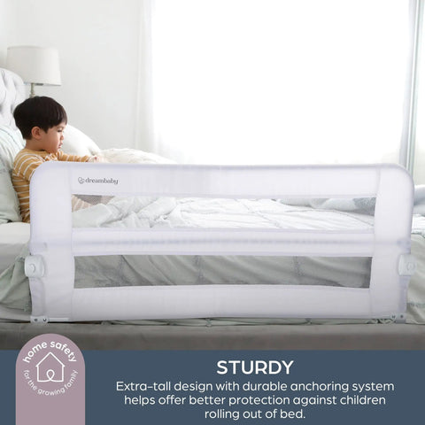 Child sitting next to Fold Down Bed Rail For Toddlers, Fits Queen Size Mattress, With Safety Anchors For Secure Sleep, white