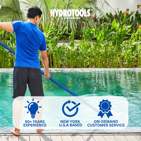 Person using a pool cleaning tool in a backyard setting, showcasing Hydrotools branding and service badges.