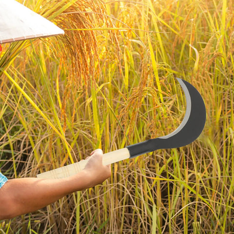 Person using Beefy Long Handle Manganese Steel Hand Scythe For Weeding And Lawn Care Black Half Moon Blade Garden Tool in a field