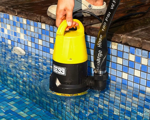 Powerful Submersible Sump Pump 5000 GPH High Flow With 25 Ft 1.5 Inch Discharge Hose Kit 1 HP Portable in pool edge.