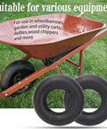 Two heavy duty 15x6.00-6 inner tubes with TR-13 straight valve for lawn mowers and ride-on mowers next to a red wheelbarrow.