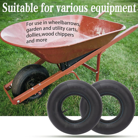 Two heavy duty 15x6.00-6 inner tubes with TR-13 straight valve for lawn mowers and ride-on mowers next to a red wheelbarrow.