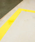 High Adhesion Floor Marking Stencil With Continuous Line For Rough Textured Surfaces, 0.25 In Height, 4 In Width, 1200 In Length, Polyester Clear White, Easy Measuring With Printer Markings For Precise, Clean Paint Lines In Busy Warehouses. yellow floor marking on rough concrete