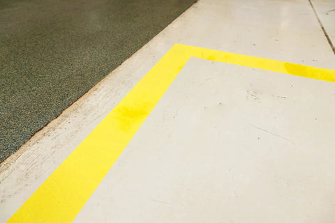 High Adhesion Floor Marking Stencil With Continuous Line For Rough Textured Surfaces, 0.25 In Height, 4 In Width, 1200 In Length, Polyester Clear White, Easy Measuring With Printer Markings For Precise, Clean Paint Lines In Busy Warehouses. yellow floor marking on rough concrete
