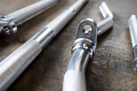Close-up of Straight Up Heavy Duty Aluminum Curl Bar Attachment Compatible With Cable Machines for home gym fitness.