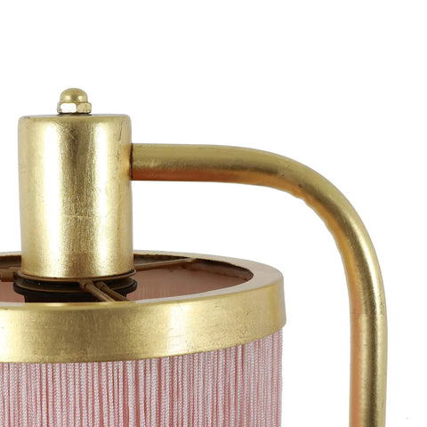Close-up of Framboise Fringe Shade Table Lamp with gold leaf finish, highlighting the pink tassel detail.