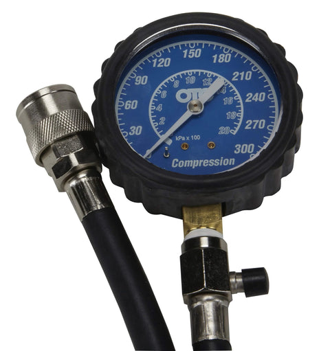 OTC 5605 Deluxe compression tester kit with blue dial gauge and black hoses