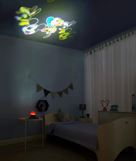 Mickey Mouse Kids Lamp And Nightlight Scene Projector with soft glow rotating projections on bedroom ceiling.