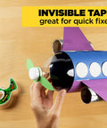 Hand using Six Rolls Of Ultra Clear Invisible Tape With Desktop Dispenser For Office Wrapping And Repairs Three Quarter Inch By One Thousand Inch Strong Adhesive Easy Tear No Fuss Desk Must Have to fix toy plane