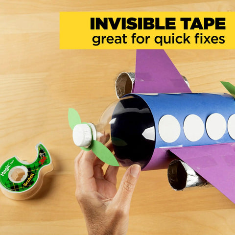Hand using Six Rolls Of Ultra Clear Invisible Tape With Desktop Dispenser For Office Wrapping And Repairs Three Quarter Inch By One Thousand Inch Strong Adhesive Easy Tear No Fuss Desk Must Have to fix toy plane
