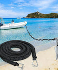 Elastic Bungee Dock Line For Boat Mooring 14 Ft Rope With 316 Stainless Steel Clips shown securing a boat on a beach