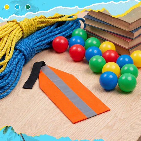 Orange Safety Travel Flag For Kayak And Canoe With Reflective Stripe And Durable Webbing Tow Kit, surrounded by ropes and colorful balls.
