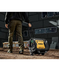 Person pulling 18 Inch Rolling Tool Bag With 27 Pockets For Rough Jobsites IP54 Water Resistant Compartment Built Tough From 1680D Fabric
