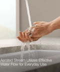 Person washing hands with Jolt Swing Spout With Integrated Side Spray over sink demonstrating water flow efficiency.