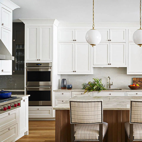 Modern kitchen with Antique Copper Single Hole Cabinet Handles Set on white cabinets and island, soft gloss finish