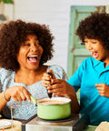 Family enjoying using Powerful Handheld Milk Frother For Coffee Lovers, Quick Foam Maker Whisk in kitchen setting