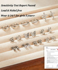 Hypoallergenic Surgical Steel Flat Back Earrings Set For Women And Girls 10 Pairs Of Cute Studs Huggie Hoops And CZ Hoop Staples With Balls Hearts Stars And Flowers Comfy All Day Jewelry Collection silver earrings on fabric display, lead and nickel free