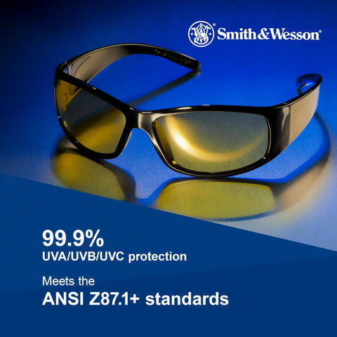 Badass Lightweight Anti Fog Safety Glasses With Amber Yellow Tinted Lenses And Sleek Black Frame For Shooting Sports, shown against a blue backdrop.