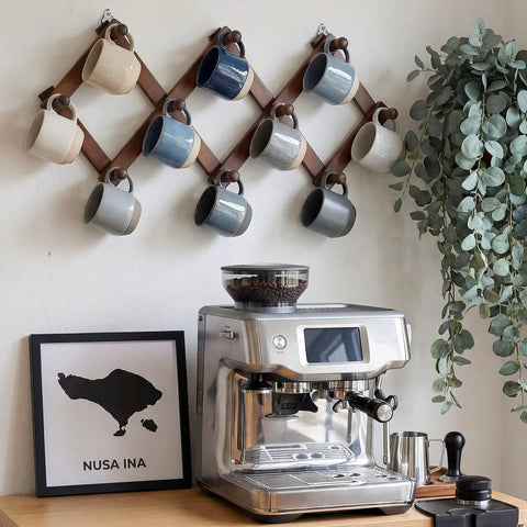Expandable Wall Mounted Hat Rack With 10 Hooks, Space Saving Coat And Mug Organizer displayed in modern kitchen.