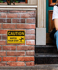 Watch Your Step Caution Sign 10 By 7 Inches Reflective Aluminum Safety Sign For Outdoor And Indoor Use mounted on brick wall