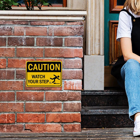 Watch Your Step Caution Sign 10 By 7 Inches Reflective Aluminum Safety Sign For Outdoor And Indoor Use mounted on brick wall