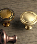 Slick Antique Brass Cabinet Knobs 6 Pack Solid Zinc Alloy Hardware Vintage Kitchen Drawer Knobs on wood surface