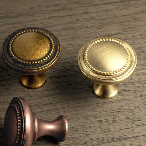 Slick Antique Brass Cabinet Knobs 6 Pack Solid Zinc Alloy Hardware Vintage Kitchen Drawer Knobs on wood surface