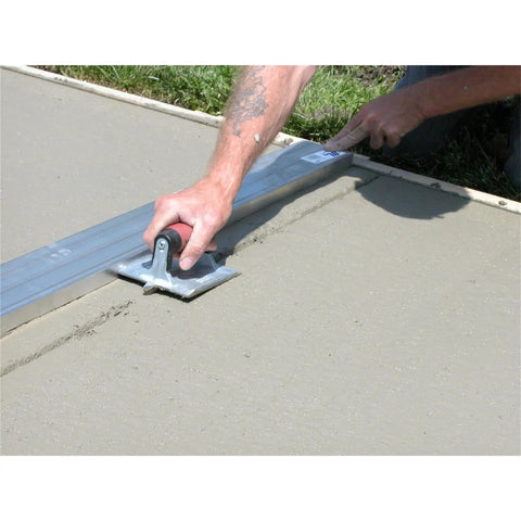 Heavy Duty Zinc Concrete Groover With DuraSoft Handle 6 By 4 And Three Eighths Inch Blade used on concrete surface