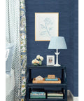 Room with Society Social Faux Grasscloth Peel And Stick Wallpaper Navy Blue as accent wall behind table and lamp