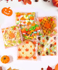 Fall Treat Bags 200 Pack, 4x4 Self Sealing Cellophane Bags with autumn leaves design, filled with cookies and candy for Thanksgiving.