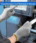 Person wearing Cut Resistant Work Gloves ANSI A5 EN388 Level 4 Breathable PU Coated Grey Non Marking For Gardening Fishing Automotive Construction And Woodworking Medium Size One Pair while operating machinery and holding a sharp blade.
