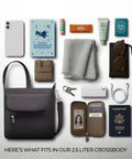 Anti-Theft Classic Mini Shoulder Bag With 5-Point Security System shown with essentials like book, passport, and sunglasses.