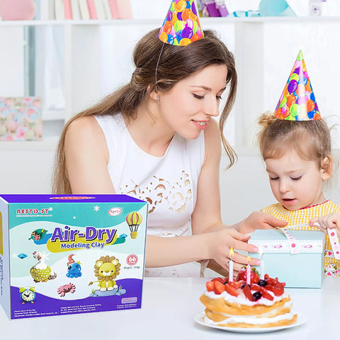 Mother and child with party hats opening gift near 66 Color Modeling Clay Kit For Kids With Tools, non sticky air dry clay box on table.