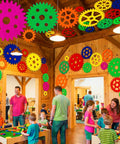 Children playing in a room decorated with Colorful Gear Shaped Felt Decor Mats Set Of 48 in various sizes on walls and ceiling.