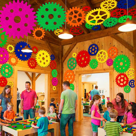 Children playing in a room decorated with Colorful Gear Shaped Felt Decor Mats Set Of 48 in various sizes on walls and ceiling.