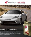 ATF Type HK Automatic Transmission Fluid For Hyundai And Kia SP III Spec 5 Quart Bottle next to a car on a curved road.