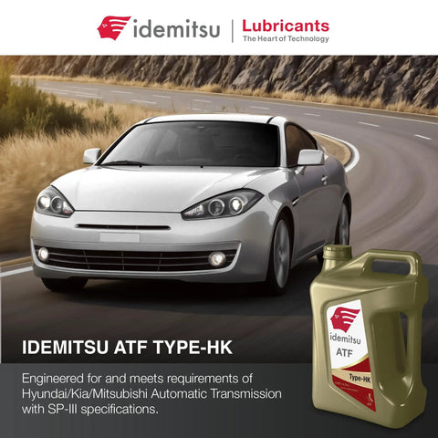 ATF Type HK Automatic Transmission Fluid For Hyundai And Kia SP III Spec 5 Quart Bottle next to a car on a curved road.