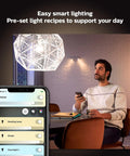 Man using phone app to control White Ambiance A19 LED Smart Bulb with 50,000 tunable white shades, compatible with Alexa and Google Assistant