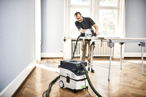 Person using CT MIDI I Dust Extractor With HEPA Filter, Bluetooth Start, AutoClean System, Heavy Duty Suction Power, and Touch Controls on flooring