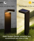 Set Of 2 Modern Solar Black Outdoor L-Shaped Path Lights With Bright LED shown charging and illuminated at night with durable stake