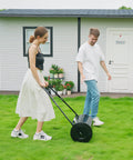Woman using Heavy Duty 38L Push And Tow Lawn Roller With U Handle Water Or Sand Fill Steel Construction For Rust Resistance Easy Roll On Lawns