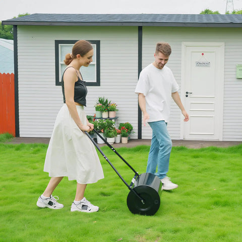 Woman using Heavy Duty 38L Push And Tow Lawn Roller With U Handle Water Or Sand Fill Steel Construction For Rust Resistance Easy Roll On Lawns
