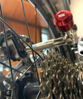 Lollipop Bit Driver Stainless Steel Red With Hidden Shaft For Quick Bit Changes And Maximum Torque shown attached to bike
