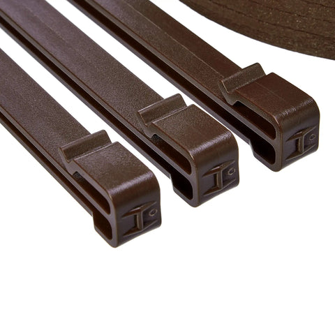 Close-up of stakes from Flexible Landscape Edging Coil 5 Inch By 40 Foot Brown With 10 Stakes For Garden Borders Pathways